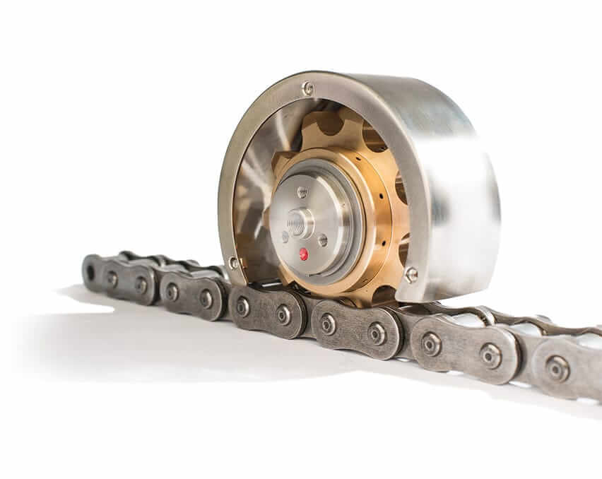 Sistema de lubricación para alta velocidad Rotalube HS de bronce o aluminio con cubierta de acero inoxidable, montado sobre una cadena de transmisión.
